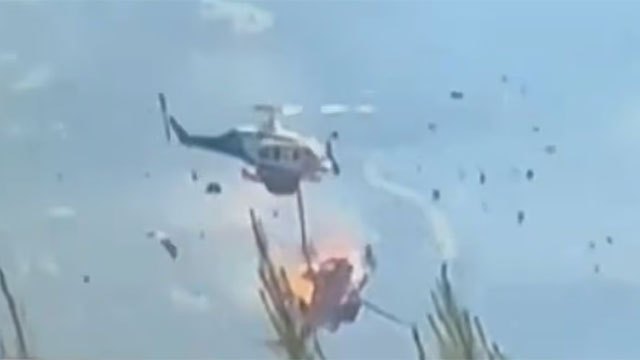 Two firefighting helicopters collide during wildfire operations west of Athens