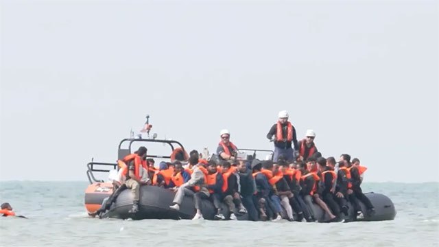 Record 230 migrants reach UK in single vessel crossing English Channel