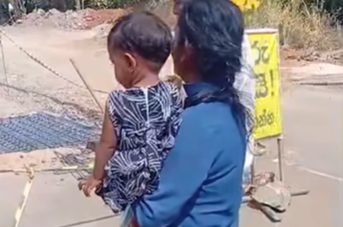 Woman protests lack of safety measures after husband's fall into roadside excavation pit